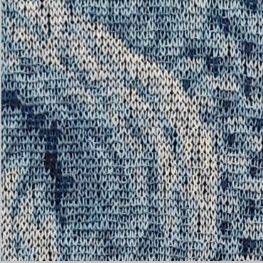 Abstract macro close-up of blue and grey merino wool stitches creating the 3D cable knit artwork